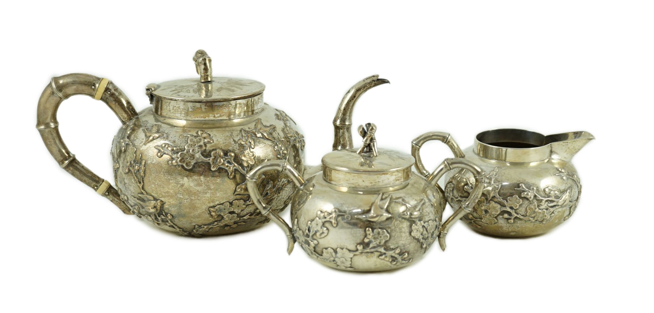 A 19th century Chinese Export silver three piece tea set by Cumshing?